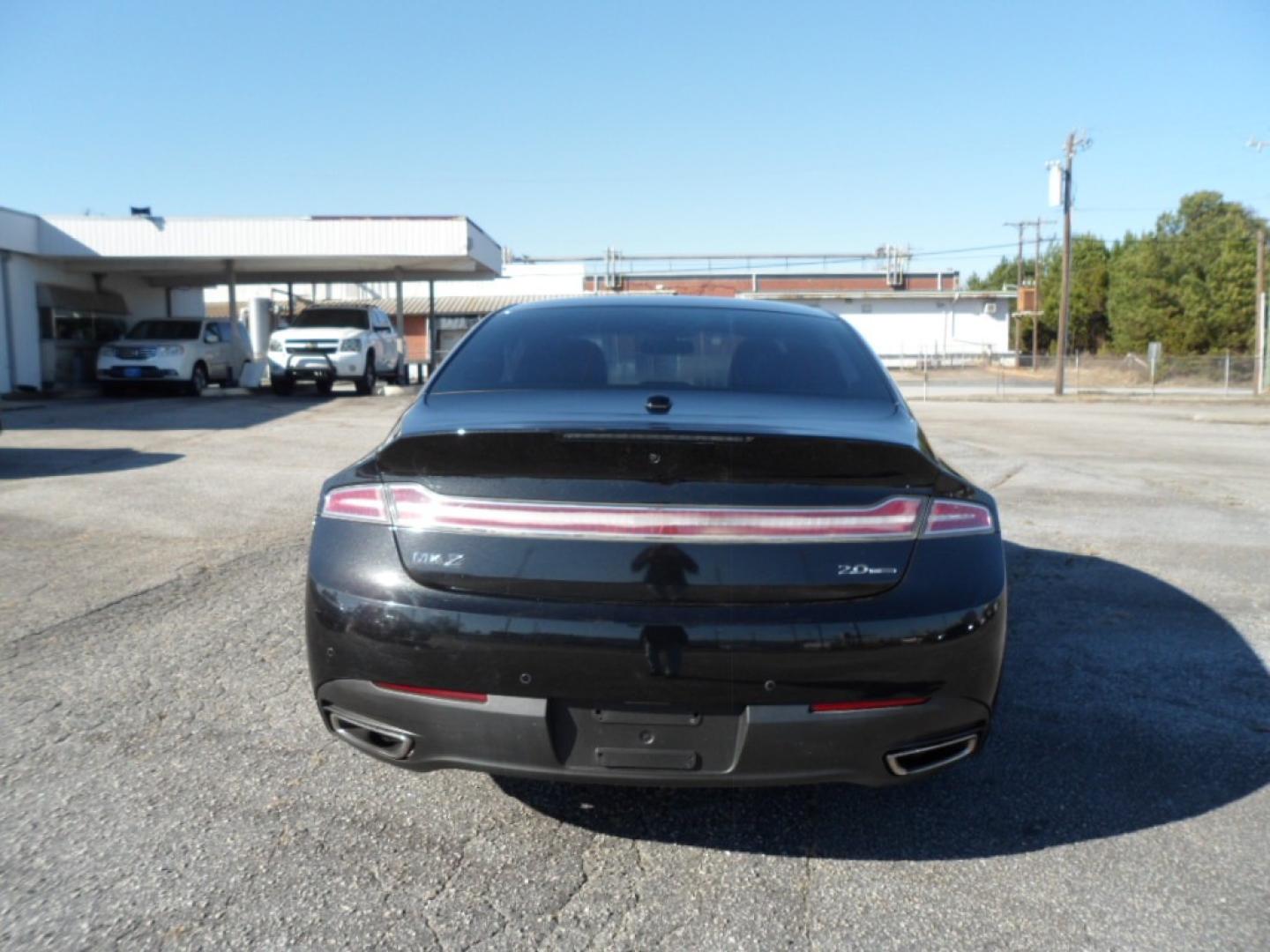 2014 BLACK /BLACK Lincoln MKZ (3LN6L2G9XER) , AUTOMATIC transmission, located at 2812 White Horse Road, Greenville, SC, 29611, (864) 269-1711, 34.808655, -82.434776 - 2.0 LITER 4 CYLINDER ENGINE,19 ICH ALLOY WHEELS,ANTI LOCK BRAKES,ANTI THEFT SYSTEM,TILT/REACH STEERING,2 ZONE A/C CLITMATE CONTROL,DUAL AIRBAGS,FRONT/REAR SIDE AIRBAGS,BODY COLOR BUMPERS,MIRRORS,AND DOOR HANDLES,CRUISE CONTROL,FOG LIGHTS,AUTOMATIC HEADLIGHTS,USB OUTLET,LIT VANITY MIRRORS,LEATHER SEA - Photo#4